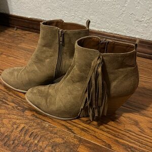 Brown heeled booties with fringe